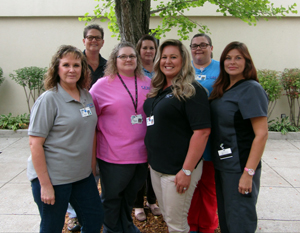 Picture of The Health Information Management. There is six females and one male.